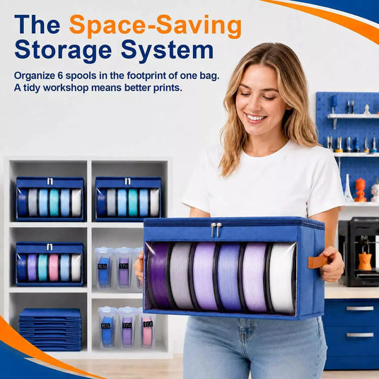 Woman carrying a blue space-saving 3D printer filament storage bag filled with six color spools in a clean workshop room.
