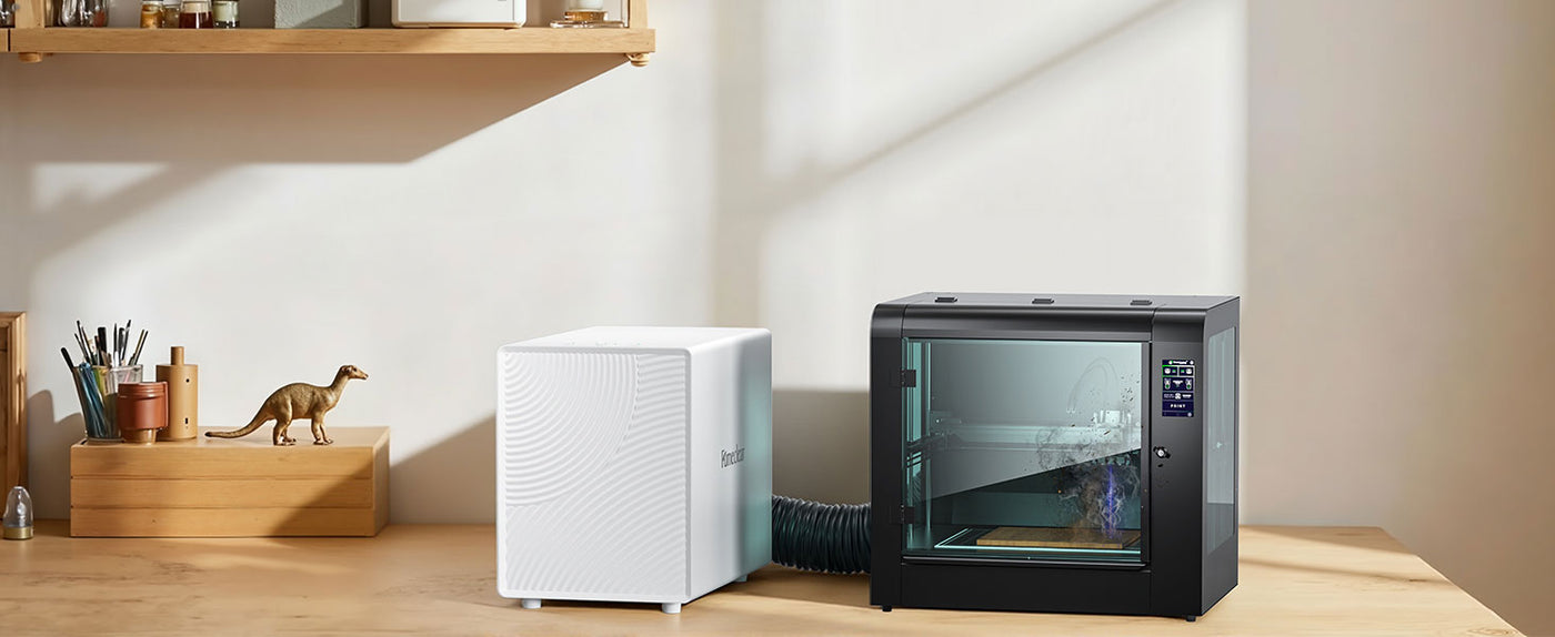 FumeClear FC-2001X compact laser smoke purifier connected to laser engraver via hose, effectively extracting fumes for a clean and healthy workspace